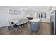 Open-concept living space with dining area, kitchen island, and seamless flow for modern living at 861 Recess Point Dr, Moncks Corner, SC 29461
