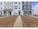 Attractive townhome featuring a walkway and manicured lawn at 861 Recess Point Dr, Moncks Corner, SC 29461