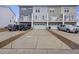 Rear view of garages and parking area at 861 Recess Point Dr, Moncks Corner, SC 29461