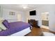 A cozy main bedroom with a bed, TV, ensuite bathroom, and dresser at 861 Recess Point Dr, Moncks Corner, SC 29461