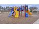 Bright and colorful community playground featuring slides, climbing structures, and soft ground cover at 861 Recess Point Dr, Moncks Corner, SC 29461