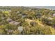 An aerial view displays a coastal community with verdant landscaping and homes at 864 Club Cottage Rd, Edisto Beach, SC 29438