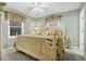 Cozy bedroom with large bed, neutral color scheme, a window, and natural light at 864 Club Cottage Rd, Edisto Beach, SC 29438