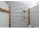 Convenient outdoor shower with white siding and a handheld shower head, ideal for rinsing off after outdoor activities at 864 Club Cottage Rd, Edisto Beach, SC 29438