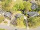 An aerial view shows a brick home at 8795 E Fairway Woods Circle, surrounded by a lush, green landscape and mature trees at 8795 E Fairway Woods Cir, North Charleston, SC 29420