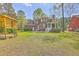 Two-story brick home with large yard and playhouse at 8795 E Fairway Woods Cir, North Charleston, SC 29420