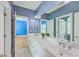 Spacious bathroom with dual sinks and large mirror at 8795 E Fairway Woods Cir, North Charleston, SC 29420