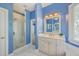 Bathroom featuring a large vanity, mirror, and walk in shower at 8795 E Fairway Woods Cir, North Charleston, SC 29420
