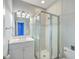 Bathroom features a glass shower, vanity with sink, tile floor, and a large mirror at 8795 E Fairway Woods Cir, North Charleston, SC 29420