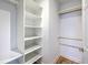Spacious walk-in closet with custom shelves and hardwood floors at 8795 E Fairway Woods Cir, North Charleston, SC 29420