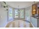 Bright dining area with large windows, pendant lighting, and access to the backyard at 8795 E Fairway Woods Cir, North Charleston, SC 29420