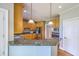 Modern kitchen featuring granite countertops, stainless steel appliances, and ample cabinetry at 8795 E Fairway Woods Cir, North Charleston, SC 29420