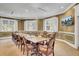 Meeting room with large windows, comfortable chairs, and a flat-screen television at 8795 E Fairway Woods Cir, North Charleston, SC 29420