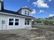 Close exterior view of this new construction home featuring gray siding and covered porch area at 941 Dusk Dr, Summerville, SC 29486