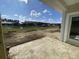 Open patio area with views of the land still under construction and a pond with homes in the distance at 941 Dusk Dr, Summerville, SC 29486