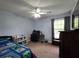Cozy bedroom with a ceiling fan and a view from the window at 104 Queen Mary Ct, Summerville, SC 29485