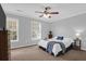 Comfortable bedroom featuring neutral walls, soft carpet, and bright windows at 104 Queen Mary Ct, Summerville, SC 29485