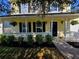Charming home featuring a welcoming front porch and well-maintained landscaping at 104 Queen Mary Ct, Summerville, SC 29485