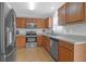 Bright kitchen with stainless steel appliances, wood cabinets and backsplash, providing style and functionality at 104 Queen Mary Ct, Summerville, SC 29485