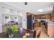 Open-concept space with a well-equipped kitchen, stainless steel appliances, wood cabinets, and hardwood floors at 104 Queen Mary Ct, Summerville, SC 29485