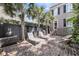 Private backyard with brick patio, lounge chairs and a grill at 106 Beaufain St, Charleston, SC 29401