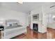 Bedroom features a fireplace with white mantle and hardwood floors at 106 Beaufain St, Charleston, SC 29401