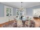 Formal dining room with a glass table, ornate chandelier, and elegant decor at 106 Beaufain St, Charleston, SC 29401