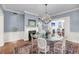 Elegant dining room with a fireplace and a view into an adjacent living room at 106 Beaufain St, Charleston, SC 29401