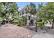 Charming home exterior with brick driveway and mature trees creating a scenic setting at 106 Beaufain St, Charleston, SC 29401