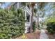 Picturesque home exterior with lush tropical landscaping enhancing curb appeal at 106 Beaufain St, Charleston, SC 29401