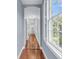 Hallway with blue walls and hardwood floors at 106 Beaufain St, Charleston, SC 29401