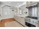 Bright kitchen with stainless steel appliances, marble countertops, and wood floors at 106 Beaufain St, Charleston, SC 29401