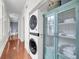 Hallway laundry closet featuring stacked washer and dryer at 106 Beaufain St, Charleston, SC 29401