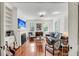Bright living room with built-in shelving, a modern fireplace, and comfortable seating at 106 Beaufain St, Charleston, SC 29401