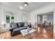 Inviting living room with comfortable seating and a view into the adjacent dining room at 106 Beaufain St, Charleston, SC 29401