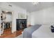 Main bedroom with fireplace, walk-in closet and hardwood floors at 106 Beaufain St, Charleston, SC 29401