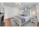Comfortable bedroom with fireplace, hardwood floors, and soft, neutral decor at 106 Beaufain St, Charleston, SC 29401