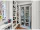Charming pantry with white shelving and grey cabinet, perfect for storage and organization at 106 Beaufain St, Charleston, SC 29401