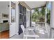 View of porch with seating and an open doorway to the interior at 106 Beaufain St, Charleston, SC 29401