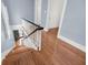 Wooden staircase leading to the front door with black trim at 106 Beaufain St, Charleston, SC 29401