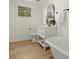 The bathroom features new vinyl floors, a soaking tub, and updated fixtures at 109 Gerideau St, Walterboro, SC 29488