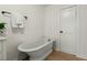 The minimalist bathroom offers a soaking tub and a modern design at 109 Gerideau St, Walterboro, SC 29488