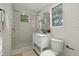 Bright bathroom features a glass-enclosed shower, vanity with storage, and modern fixtures at 109 Gerideau St, Walterboro, SC 29488