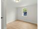 This empty bedroom has new vinyl floors, a window, and fresh paint at 109 Gerideau St, Walterboro, SC 29488