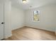 Bright bedroom featuring modern vinyl floors and a large window for natural light at 109 Gerideau St, Walterboro, SC 29488