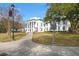 Classical architecture of the Colleton County Courthouse, featuring white columns, a lawn, and historical markers at 109 Gerideau St, Walterboro, SC 29488