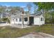 Charming home with a covered front porch and well-maintained landscaping at 109 Gerideau St, Walterboro, SC 29488
