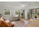 Sunlit room featuring a decorative rug, stylish furniture, and a sliding glass door at 109 Gerideau St, Walterboro, SC 29488