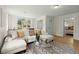 Comfortable living room featuring a large sectional, neutral decor, and great natural light at 109 Gerideau St, Walterboro, SC 29488