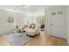 Bright and airy living room with a modern interior design with beautiful hardwood floors at 109 Gerideau St, Walterboro, SC 29488